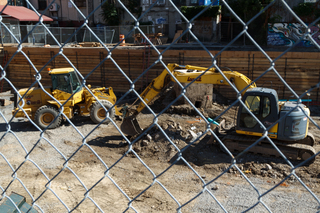 Construction equipment is seen near South Crouse Avenue as work continues to level the land before building a multilevel student housing project. Photo taken Aug. 8, 2017